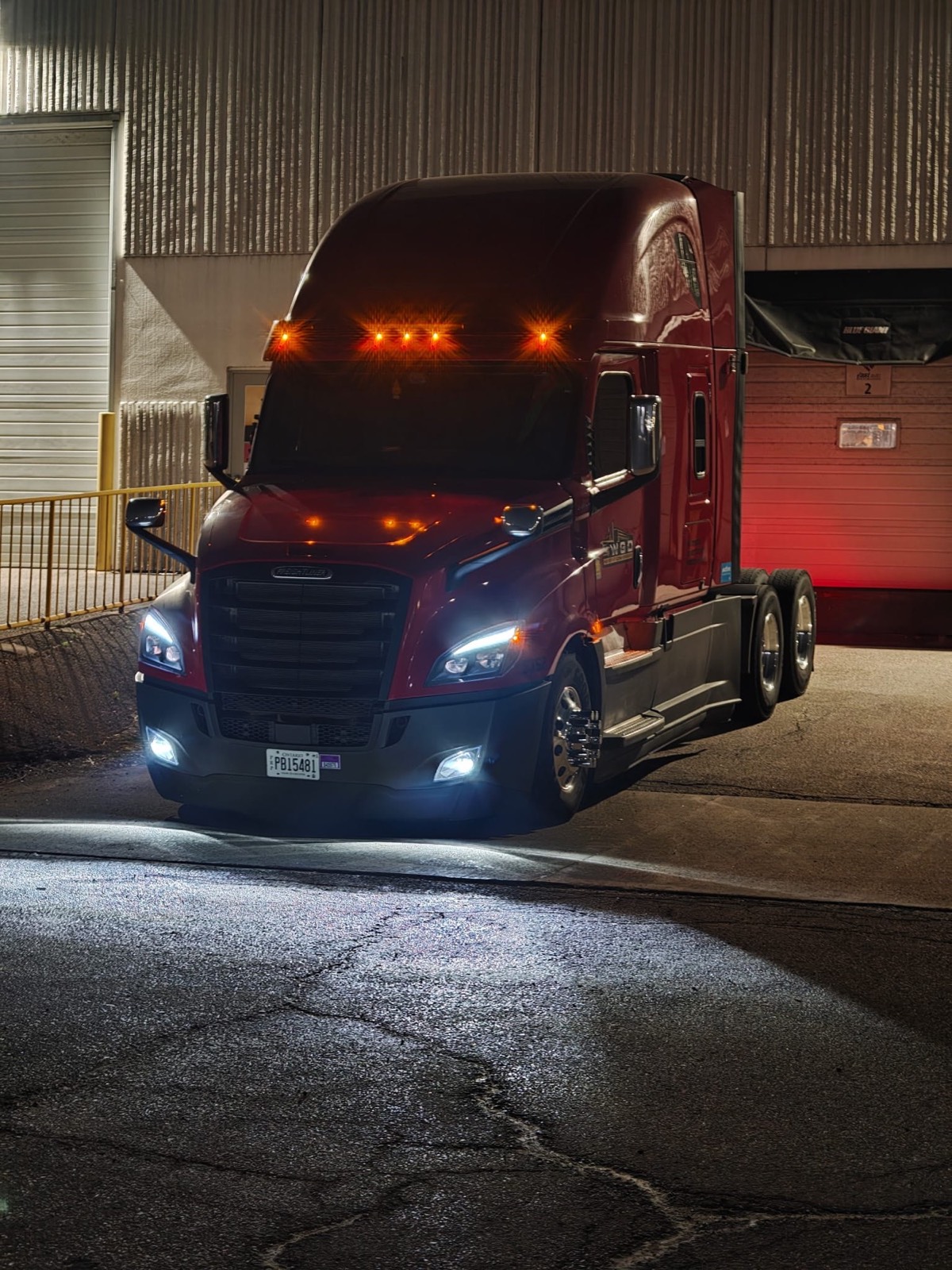 Maroon WGD Expedite tractor at night